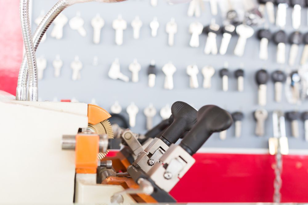 A Close Up of a Key Cutting Machine in a Locksmith Shop — Grace Locksmiths In Edmonton, QLD