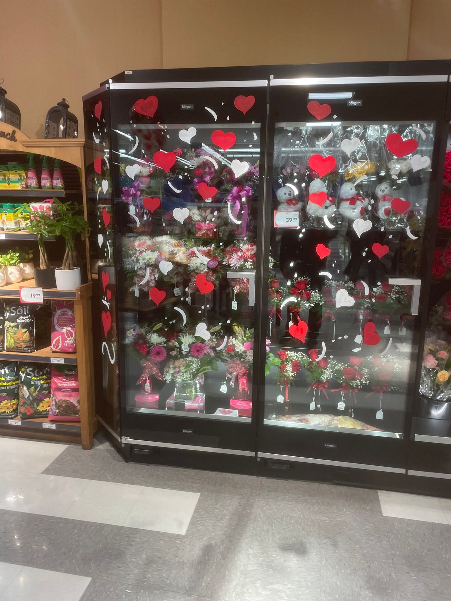 A display case filled with flowers and hearts for valentine 's day