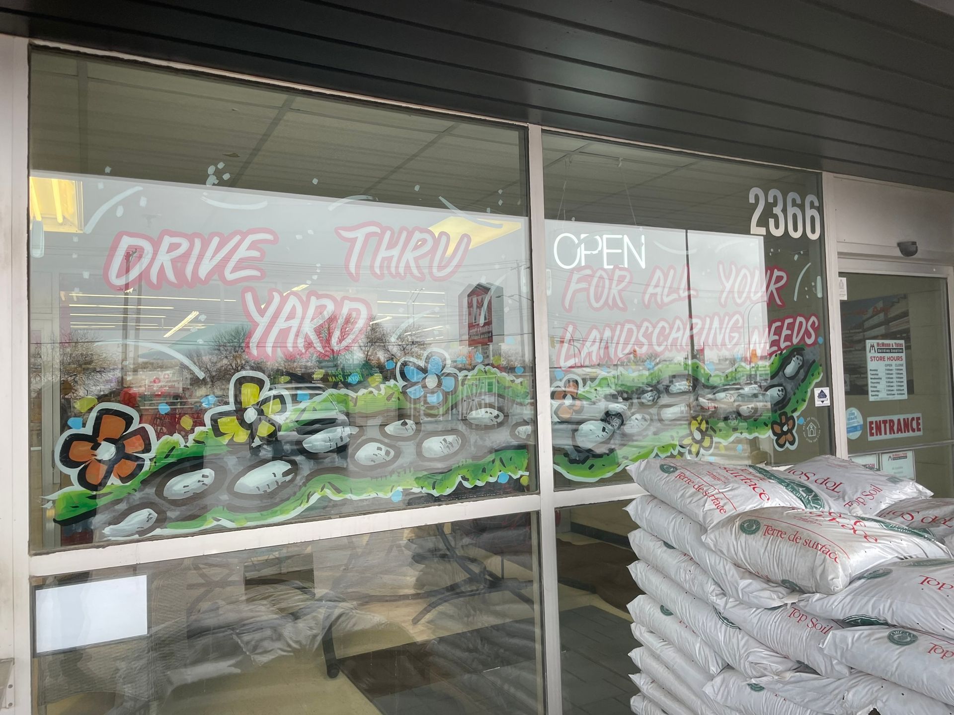 A store front with a sign that says drive thru yard