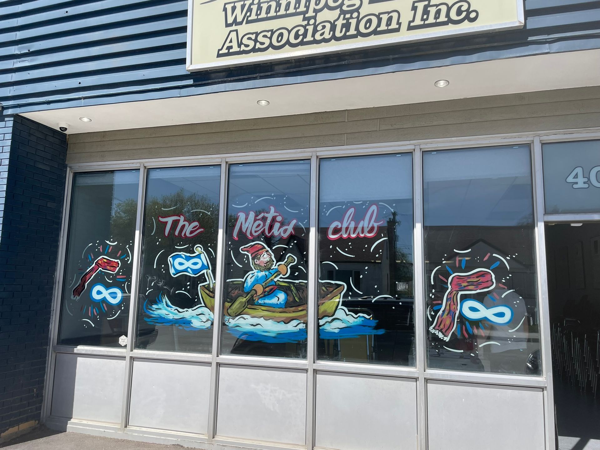 A building with a sign that says winnipeg association inc.