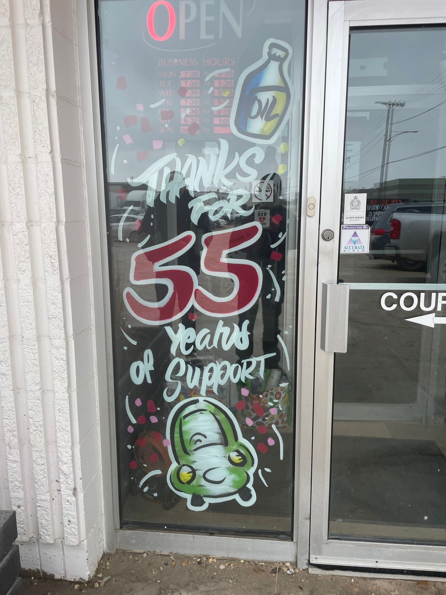A glass door with a sign that says 55 years of support