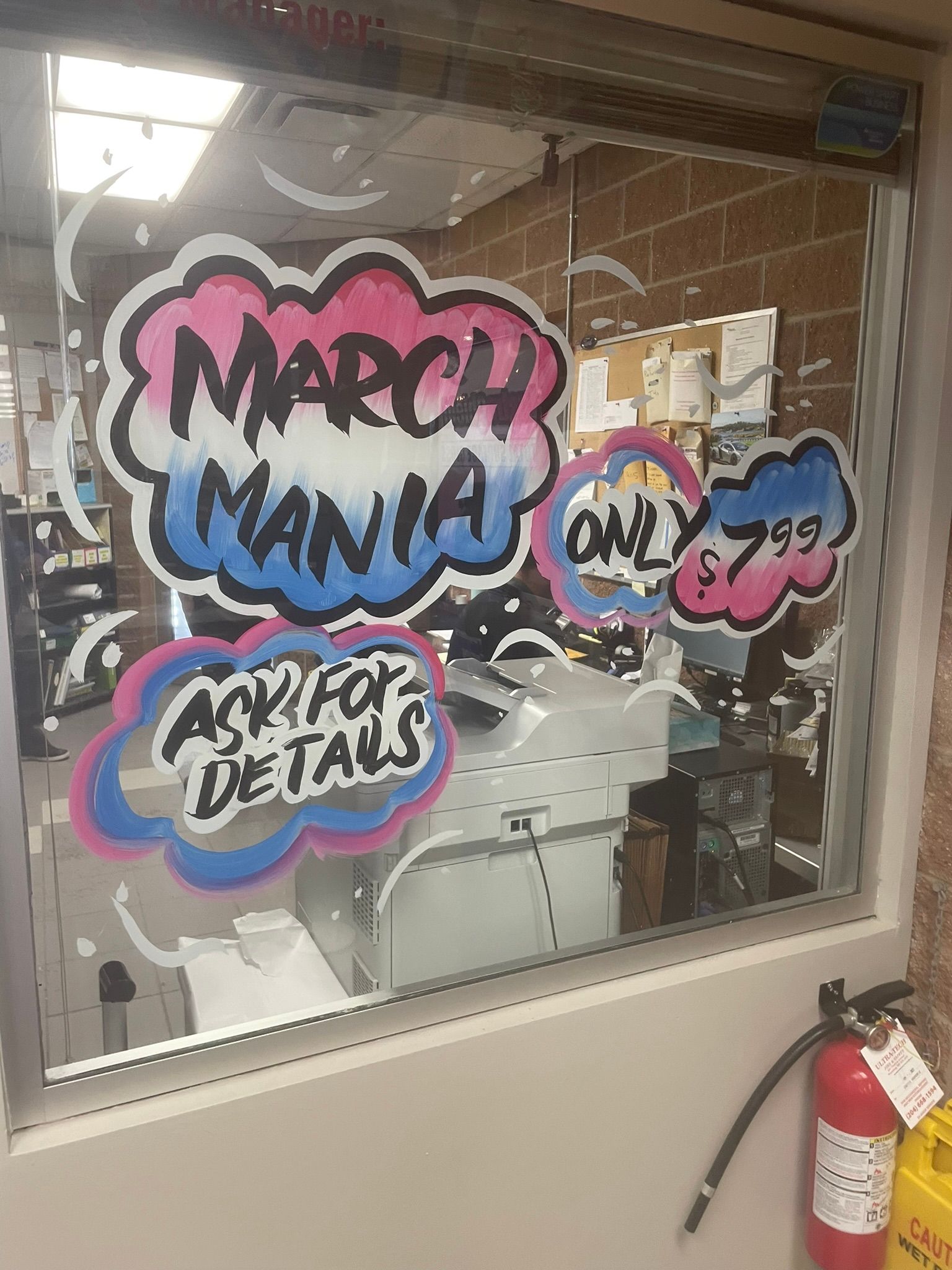 A window with a sign that says march mania on it