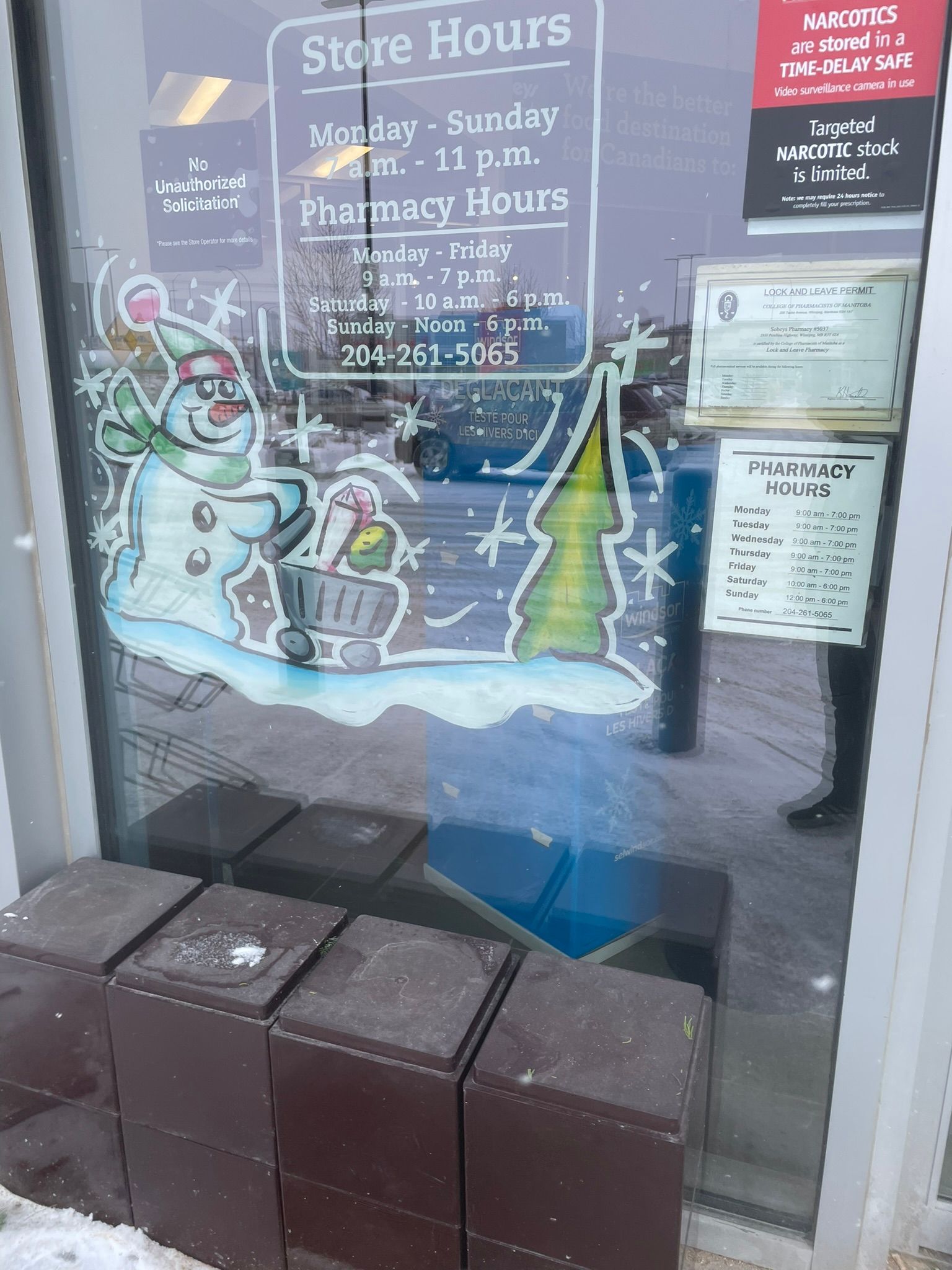 A store front with a sign that says store hours