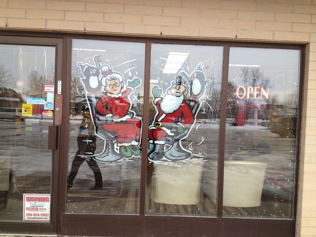 A store front with a painting of santa claus and a sign that says open