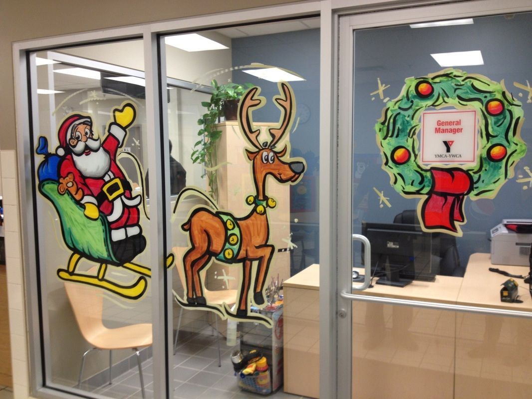 A window with a picture of santa and a reindeer on it