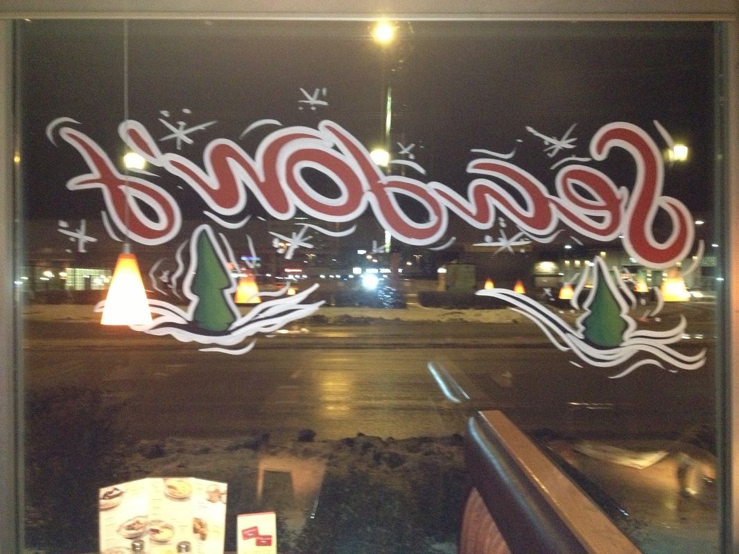 A window with the word two birds painted on it