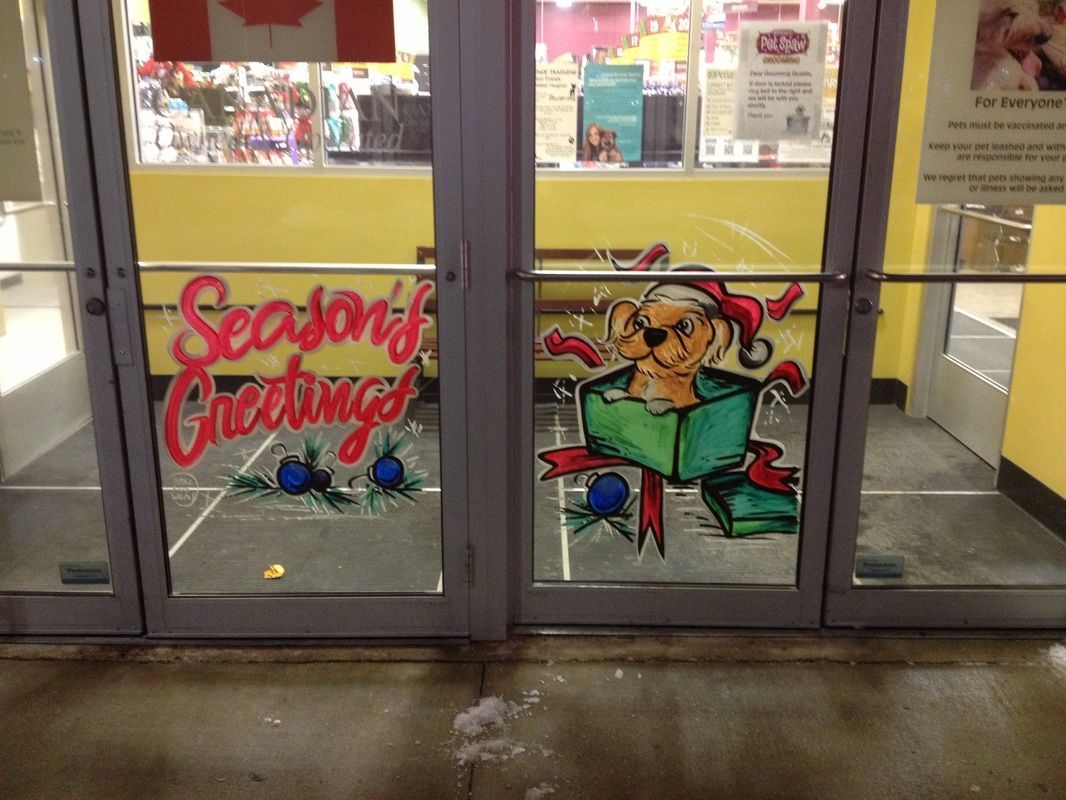 A door with a painting on it that says season 's greetings
