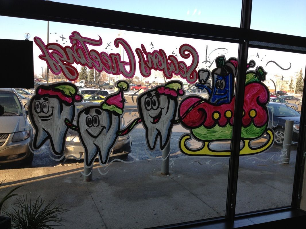 A window with a drawing of a tooth on it