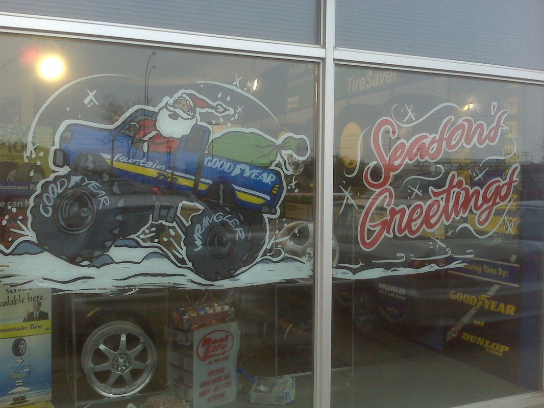 A window with a picture of santa on it and the words season 's greetings