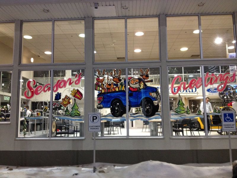 A store front with a christmas decoration and a sign that says season 's greetings