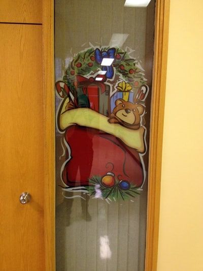 A door with a picture of a christmas stocking on it