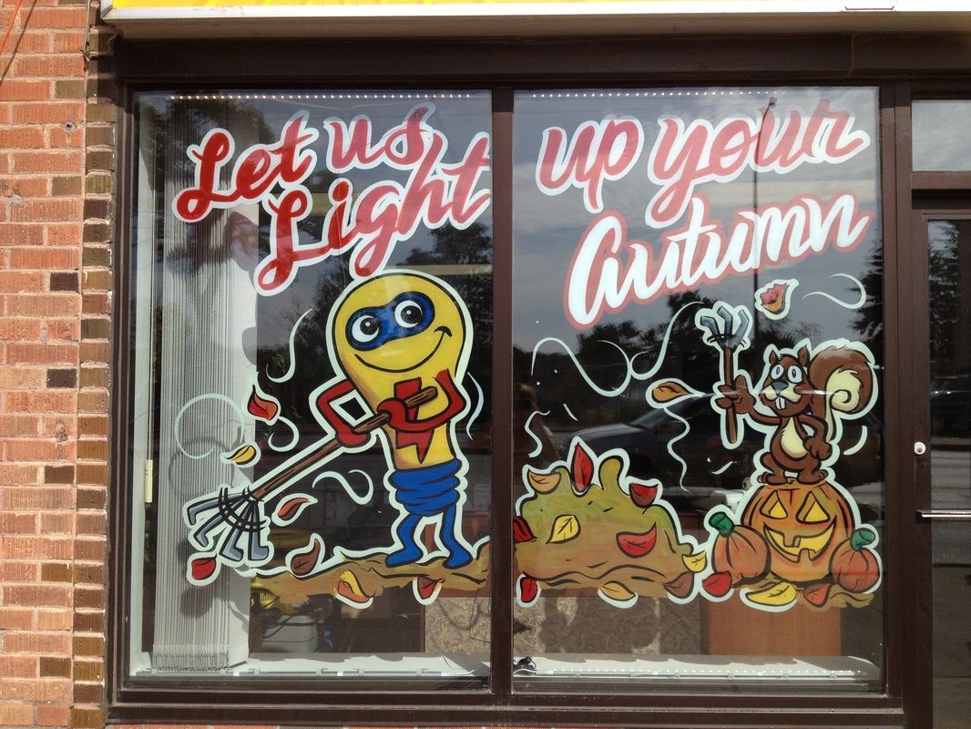 A window with a cartoon character and the words let us light up your autumn
