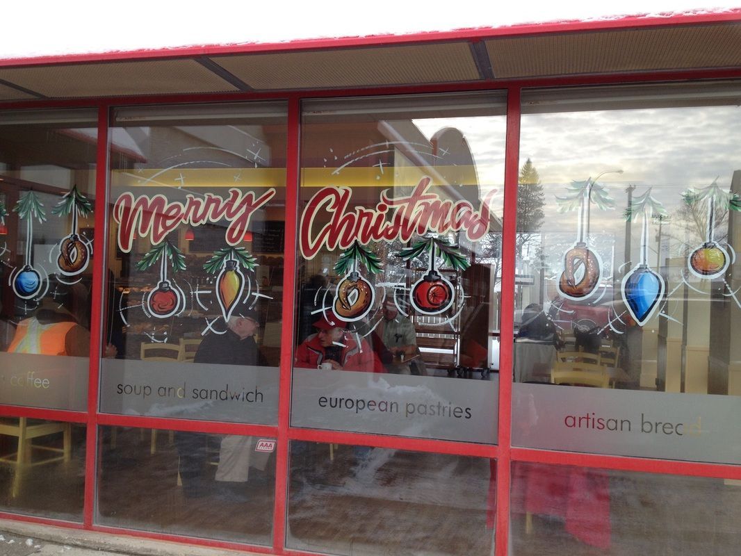 A window with a merry christmas sign on it