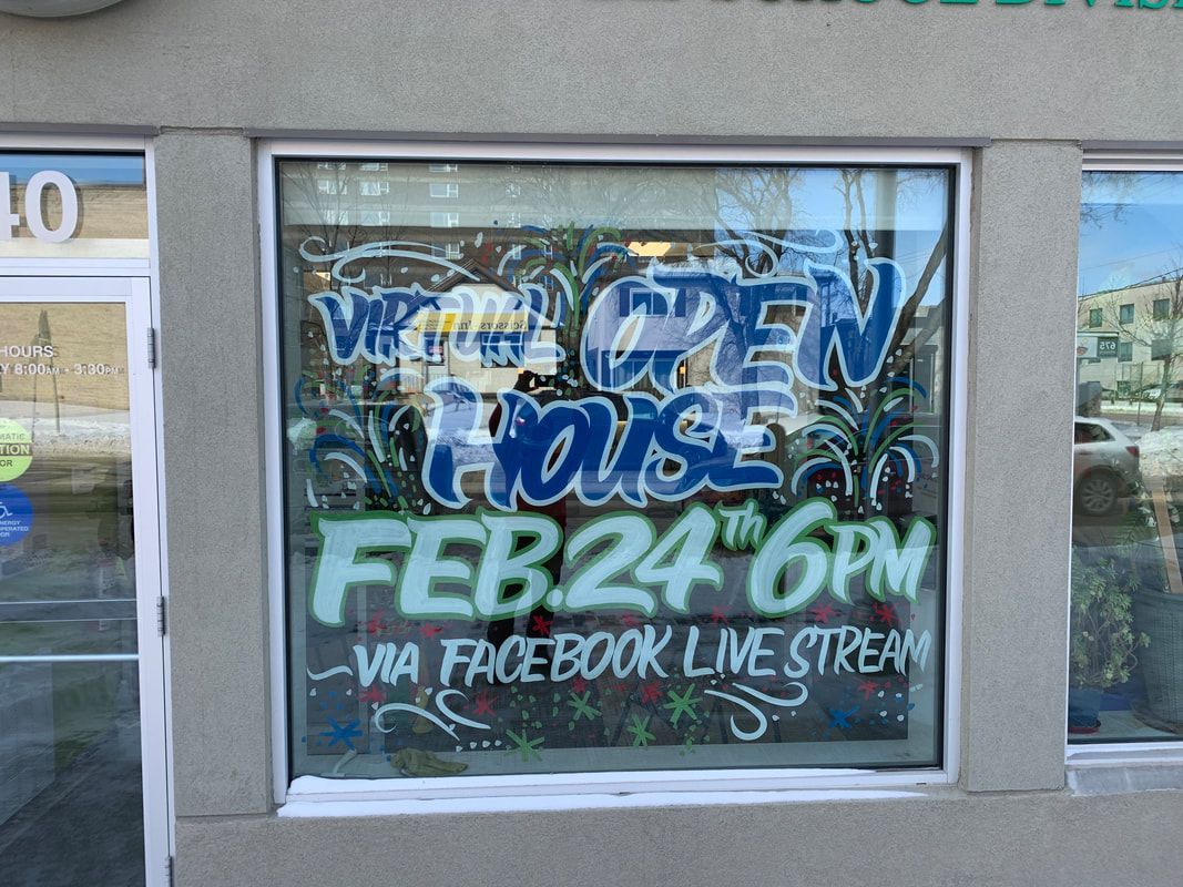 A window with a sign that says welcome house feb 24th 6pm via facebook live stream