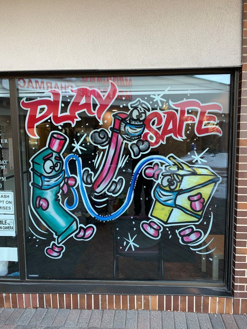 A drawing on a window that says play safe