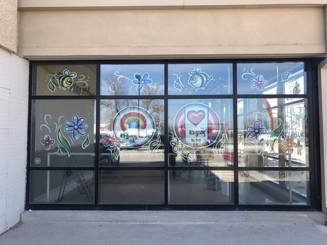 A building with a lot of windows with drawings on them.