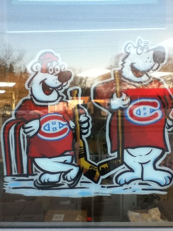A cartoon of two hockey players with the letter c on their shirts