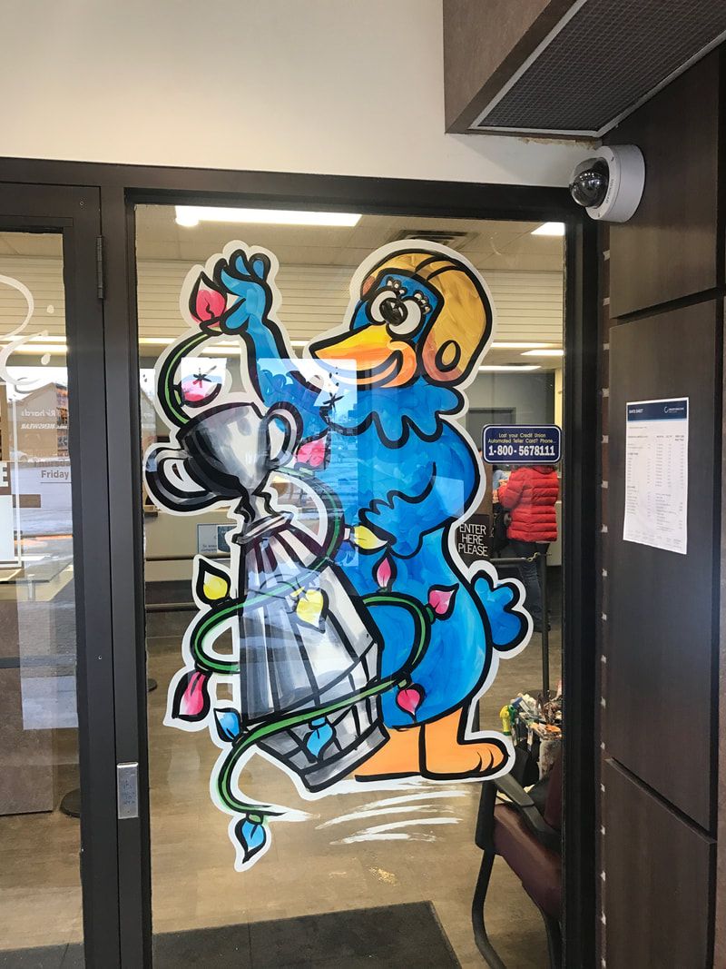 A cartoon duck is holding a trophy in a doorway.