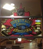 A window with a painting of a hockey logo on it.