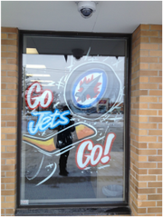 A window that says go jets go on it