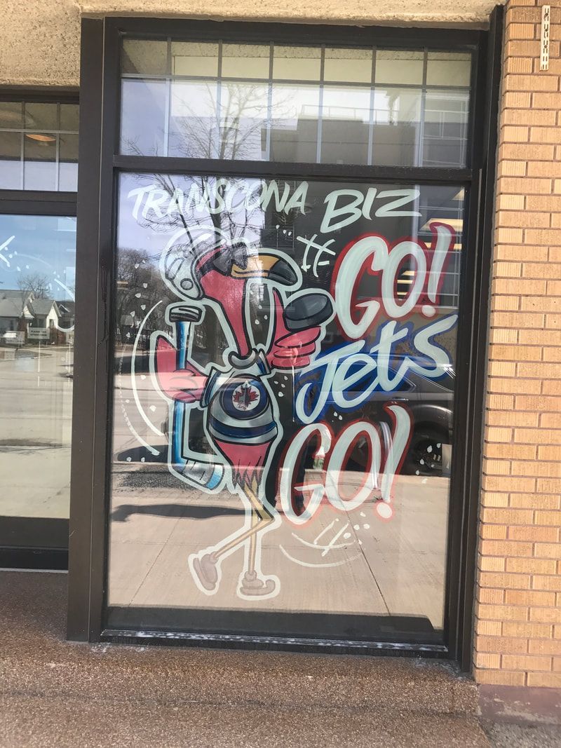 A window with graffiti on it that says go jets go
