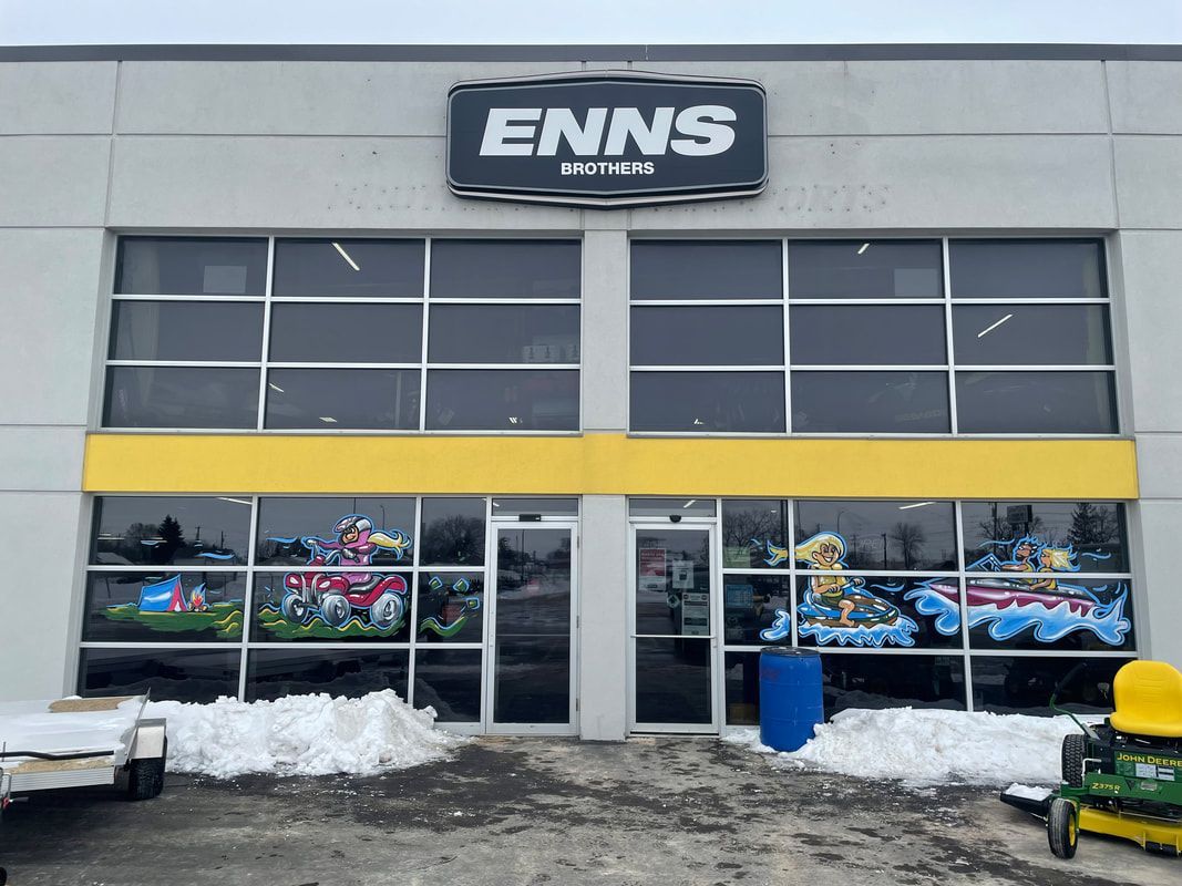 A large building with a sign that says enns on it.