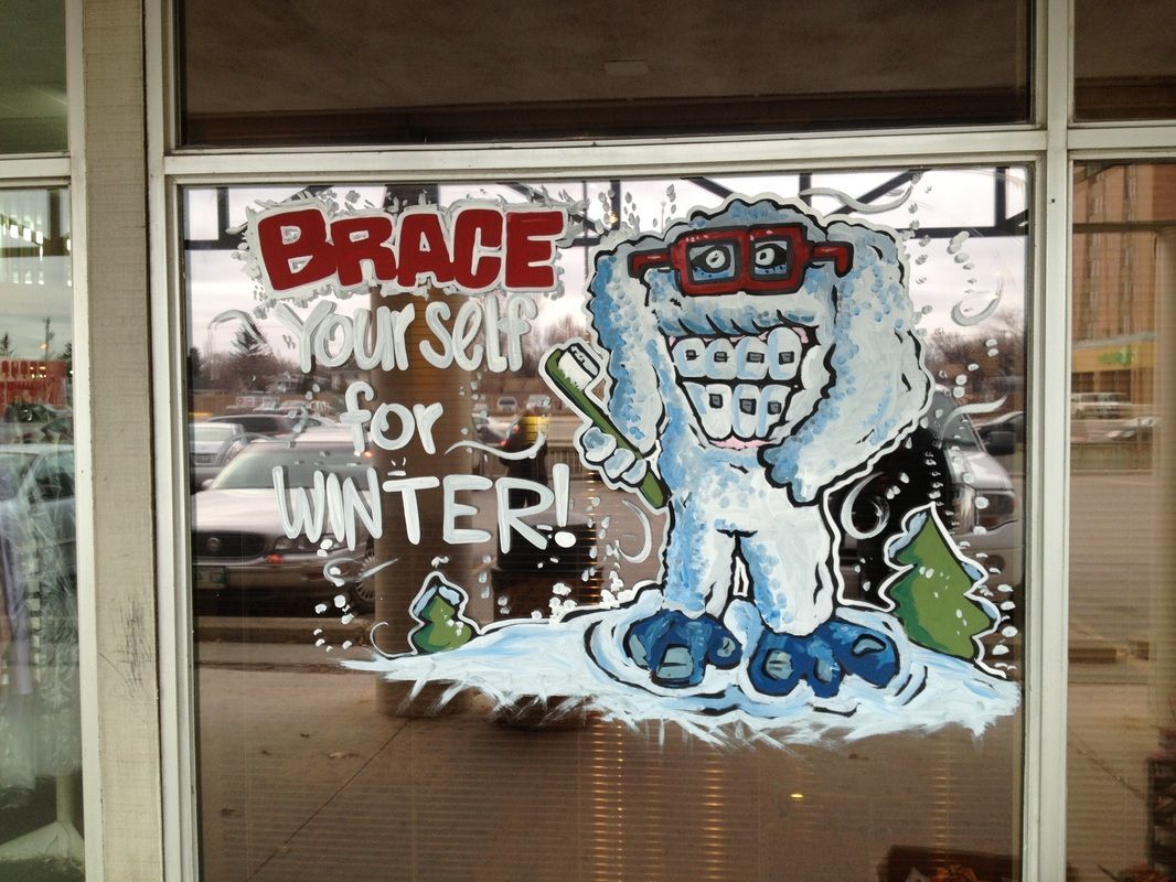 A window with a drawing of a yeti and the words brace yourself for winter