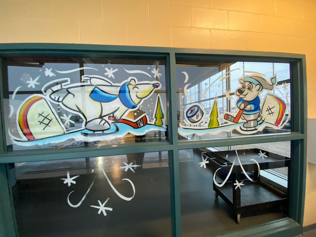 A window with a polar bear and a dog on it