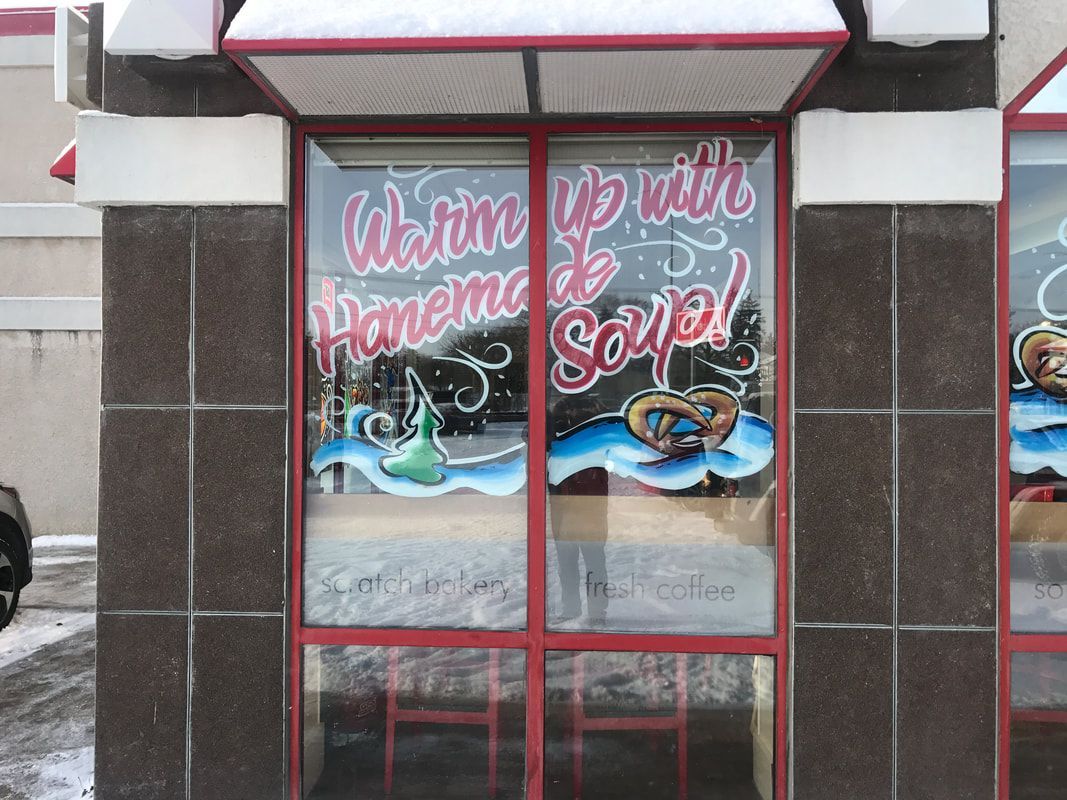 A store front with a sign that says we are up with homema & sonja