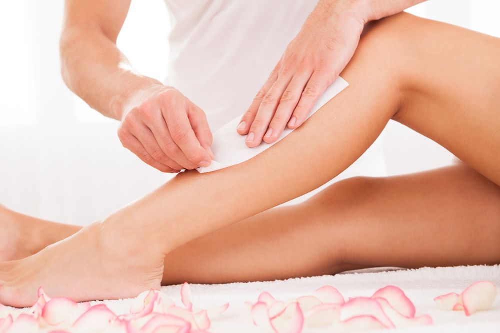 Person Waxing a Leg with A Wax Strip in A Spa-Like Setting — Soul Good Beauty in Miami, QLD