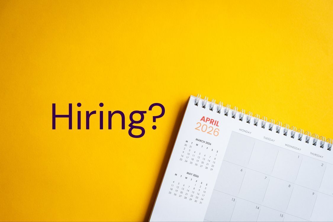 “Hiring?” text beside a desk calendar on a bright yellow background