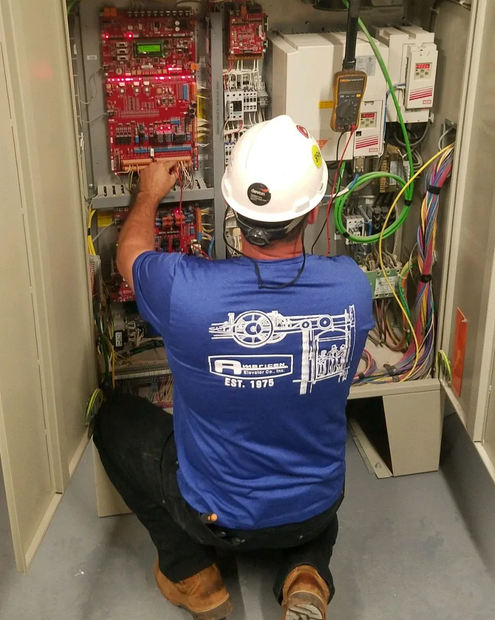 Technician Repairing Elevator — Oklahoma City, OK — American Elevator Company