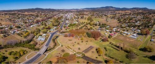An Aerial View of a Small Town Surrounded by Trees and a Highway — Active Cleaning Service Raymond Terrace, NSW