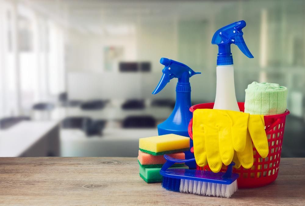 Basket Filled With Cleaning Supplies on a Wooden Table — Active Cleaning Service Rutherford, NSW