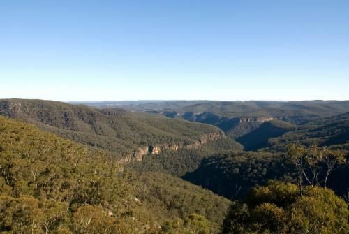 View of a Valley Surrounded by Mountains and Trees on a Sunny Day — Active Cleaning Service Cessnock, NSW