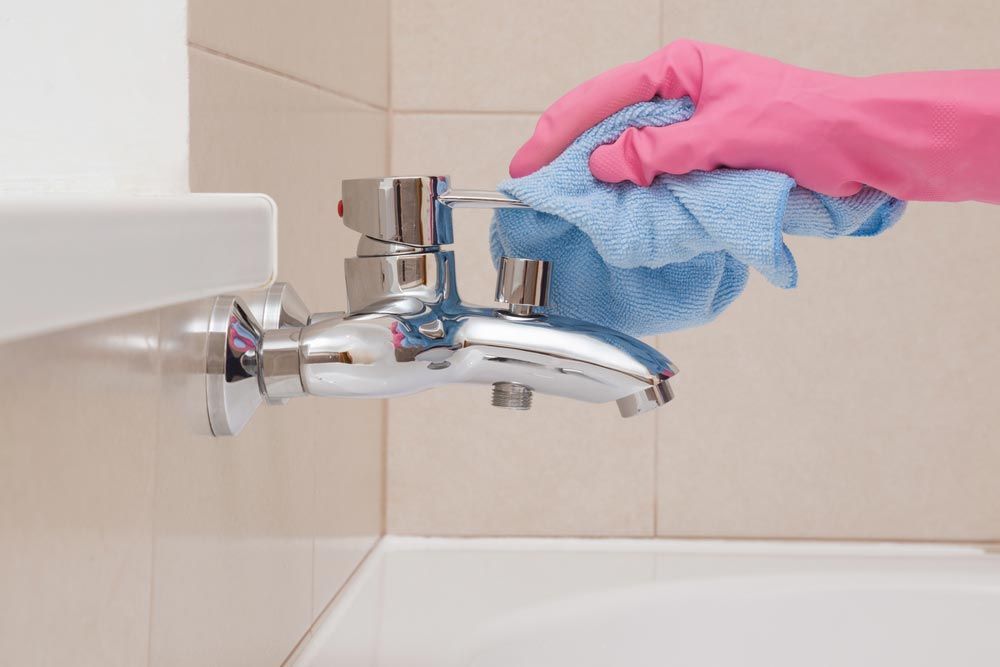 A Person Wearing a Pink Glove Cleaning A Person Wearing a Pink Glove Cleaning