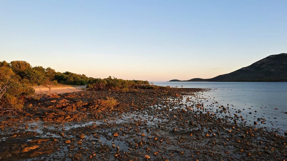 A Large Body Of Water With A Mountain In The Background —Aircon Mid North Coast in Gloucester, NSW