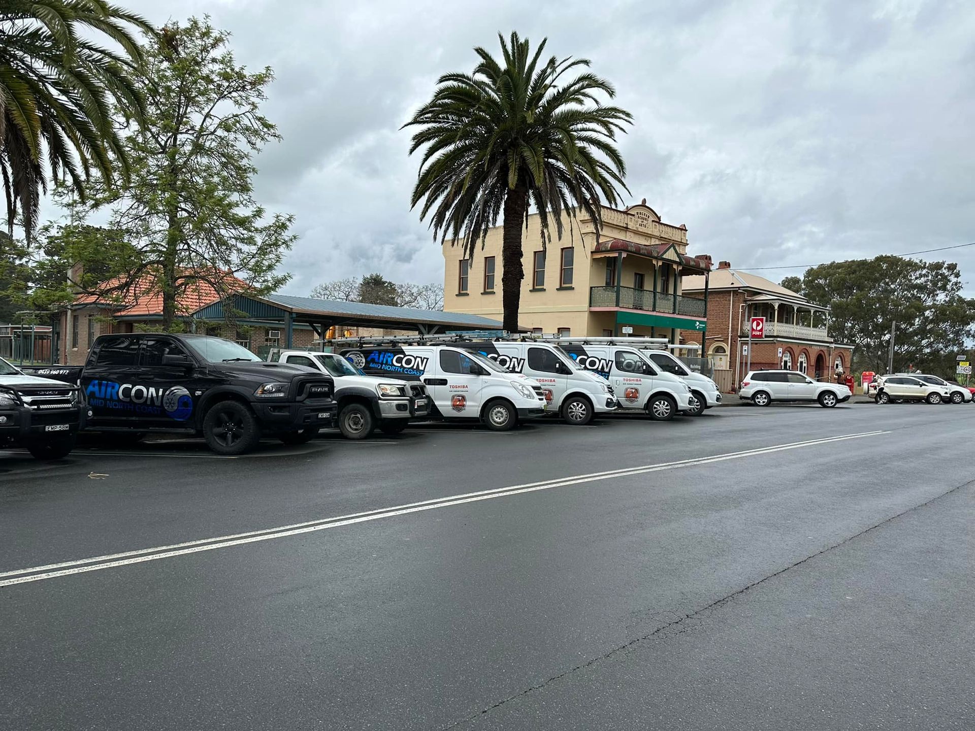 Technician Walking while Holding Electrical Tools — Aircon Mid North Coast in Forster, NSW