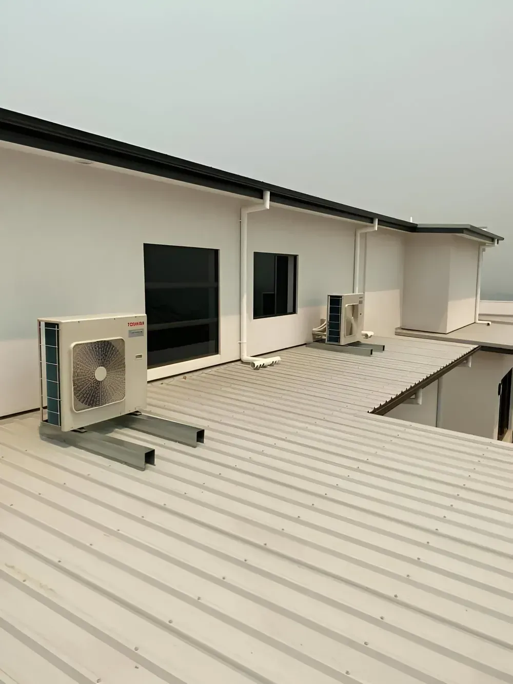 Air Conditioning Units On A Metal Roof
