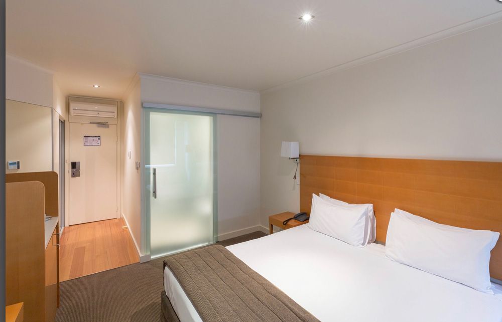 Modern bedroom with aircon — Air Conditioning Electricians in Forster NSW