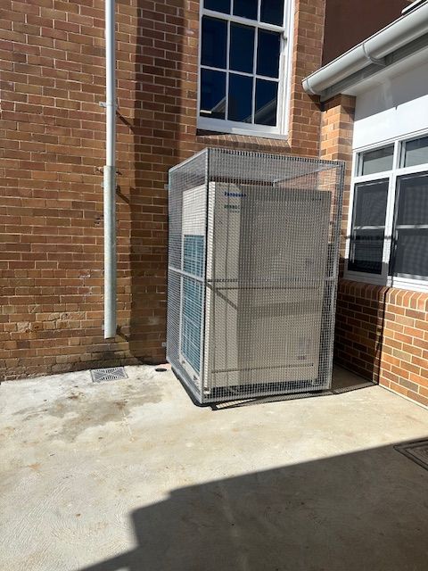 A Ceiling Fan Is Hanging From The Ceiling Of A Building — Aircon Mid North Coast in Forster, NSW