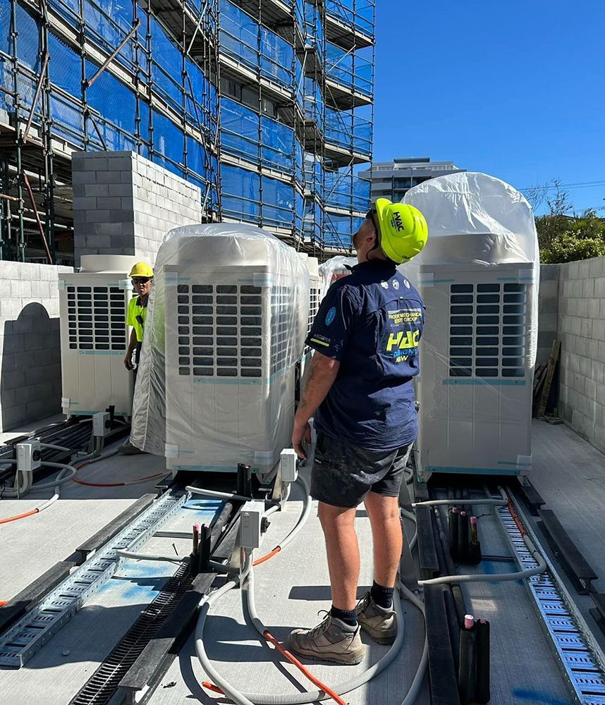 Workers Installing Large HVAC Units
