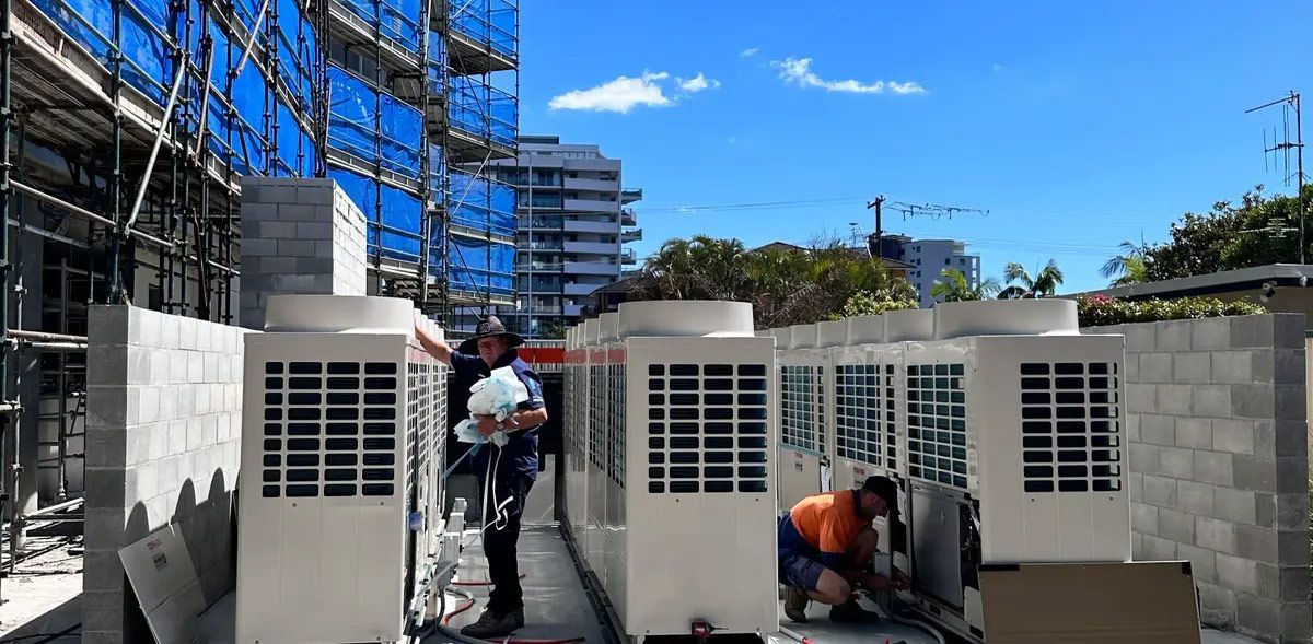 Tam Working On Air Compressor At The Roof Top — Aircon Mid North Coast in Port Macquarie, NSW