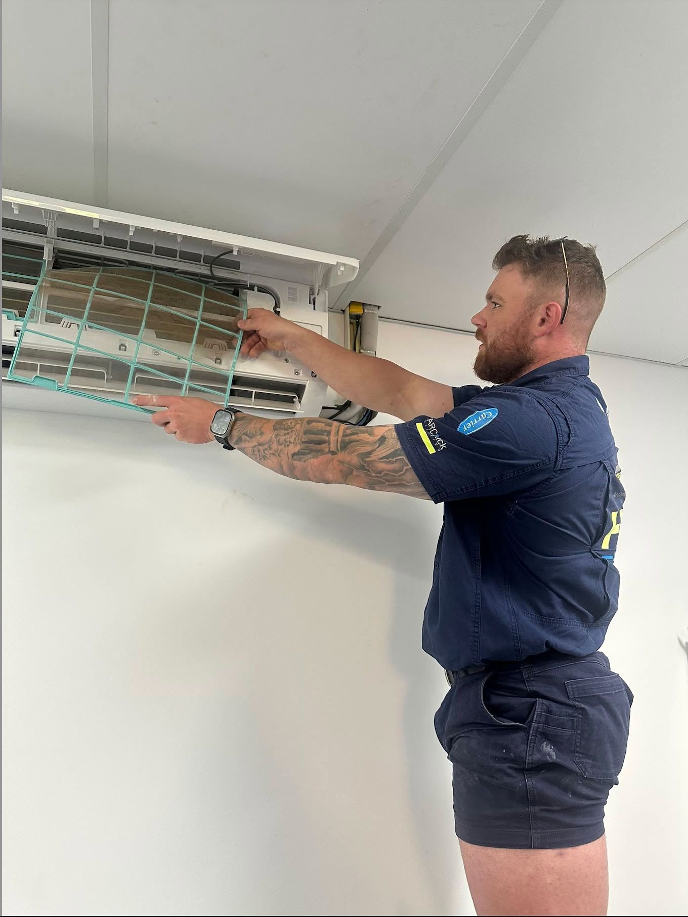 Man Servicing an Air Conditioner