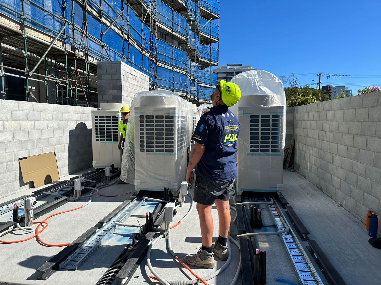 Man Working To Install An Air Conditioning Unit