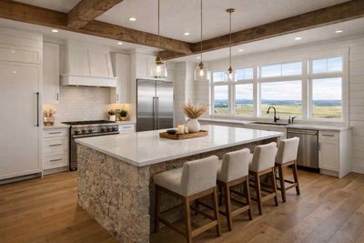 A bright kitchen with white cabinets, gold hardware, wood shelves, and a blue-and-white chevron tiled floor.