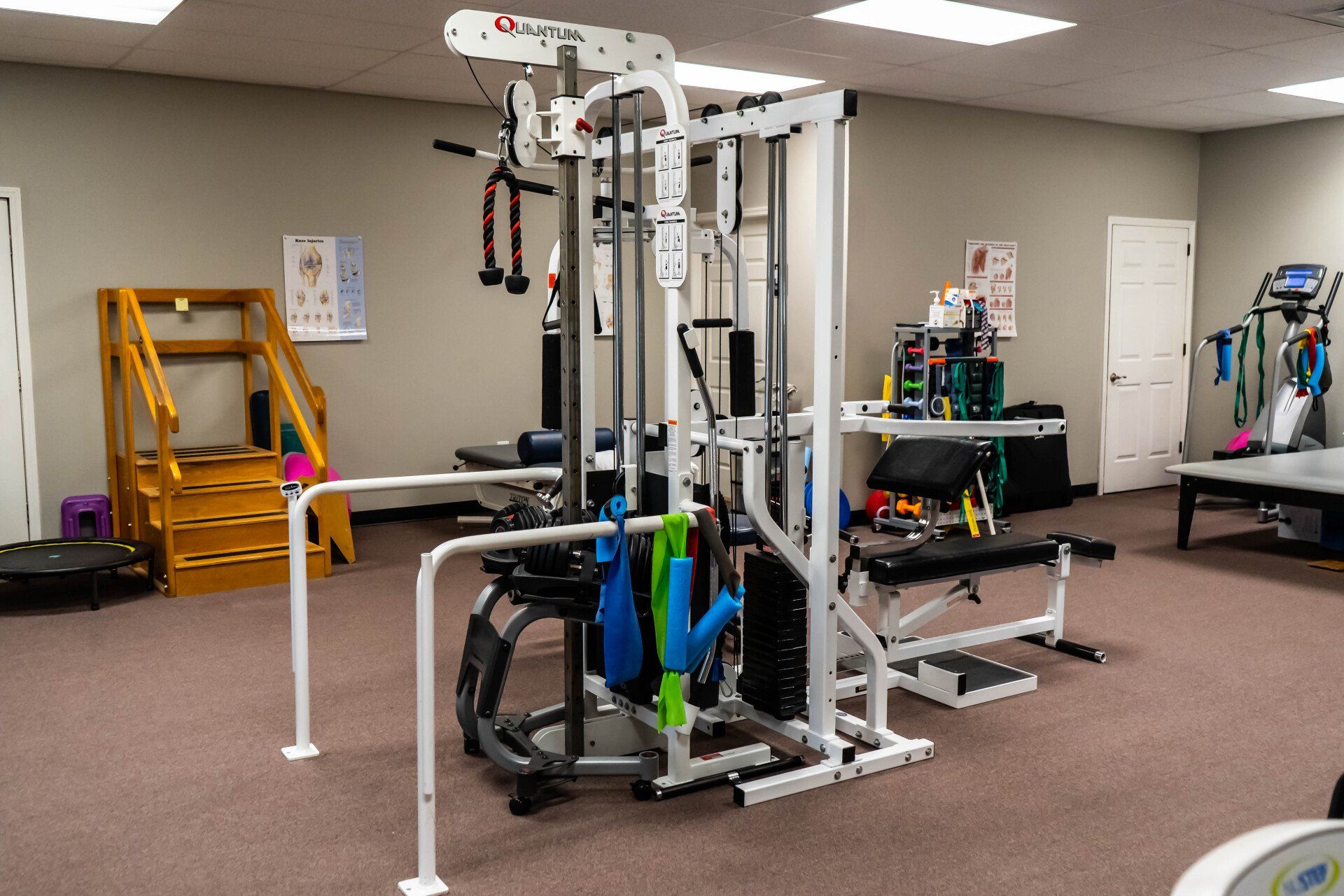 there are many different types of exercise equipment in this room .