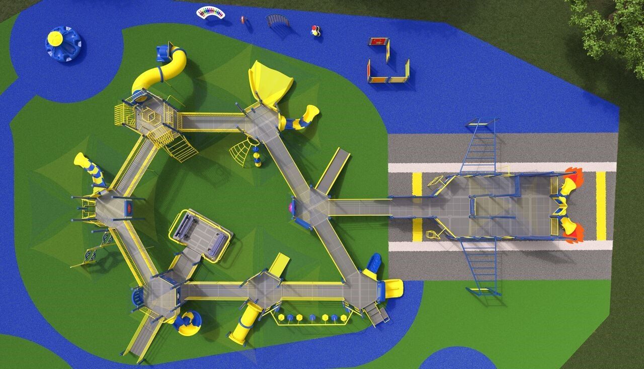 An aerial view of a playground with yellow and blue slides
