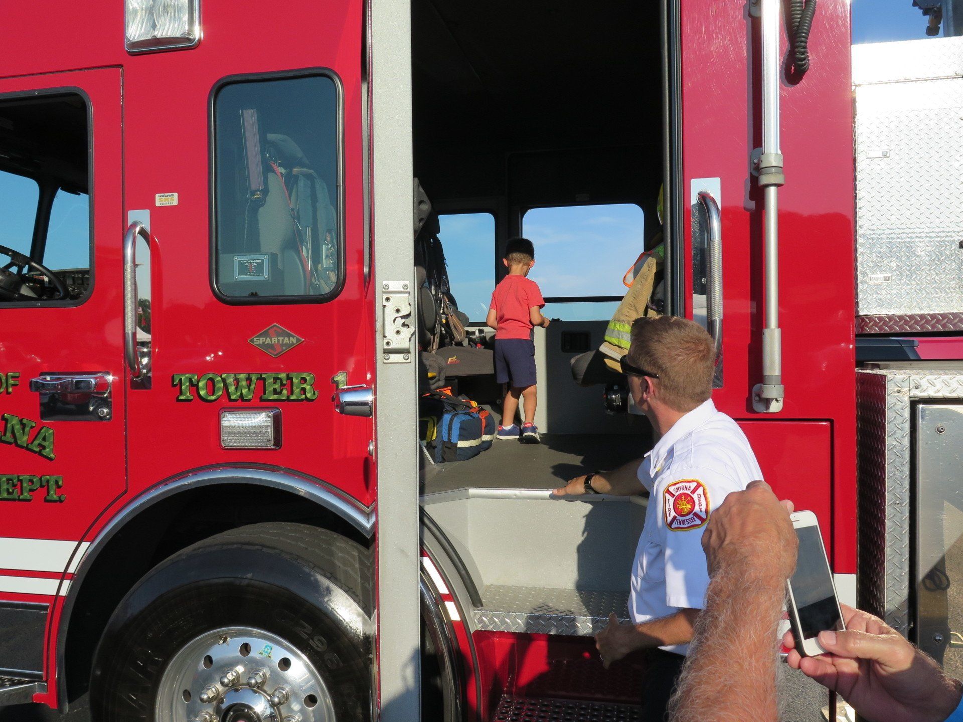A red fire truck with the word tower on the side