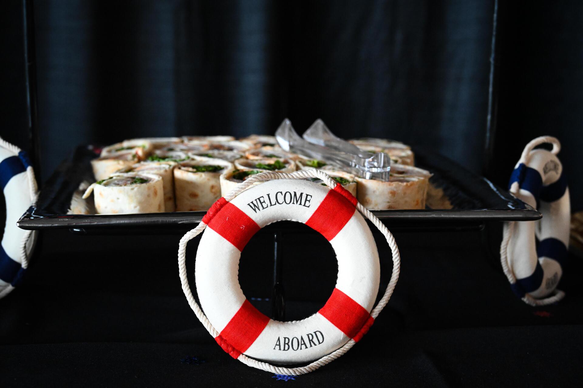 A life preserver is sitting next to a tray of food.